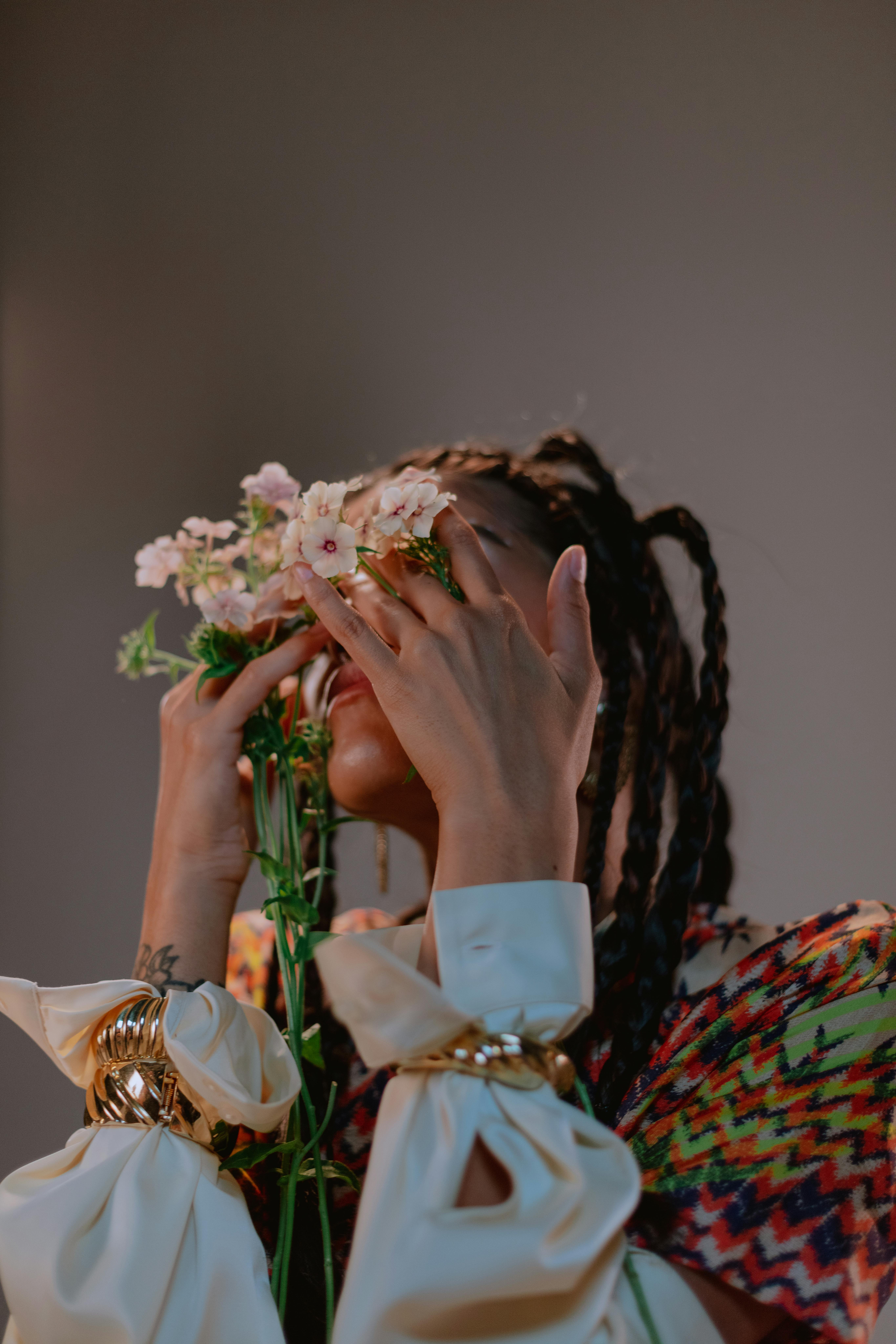 Free Woman in Traditional Wear holding Flowers Stock Photo