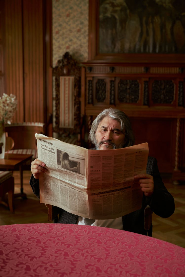 Senior Man Reading Newspaper