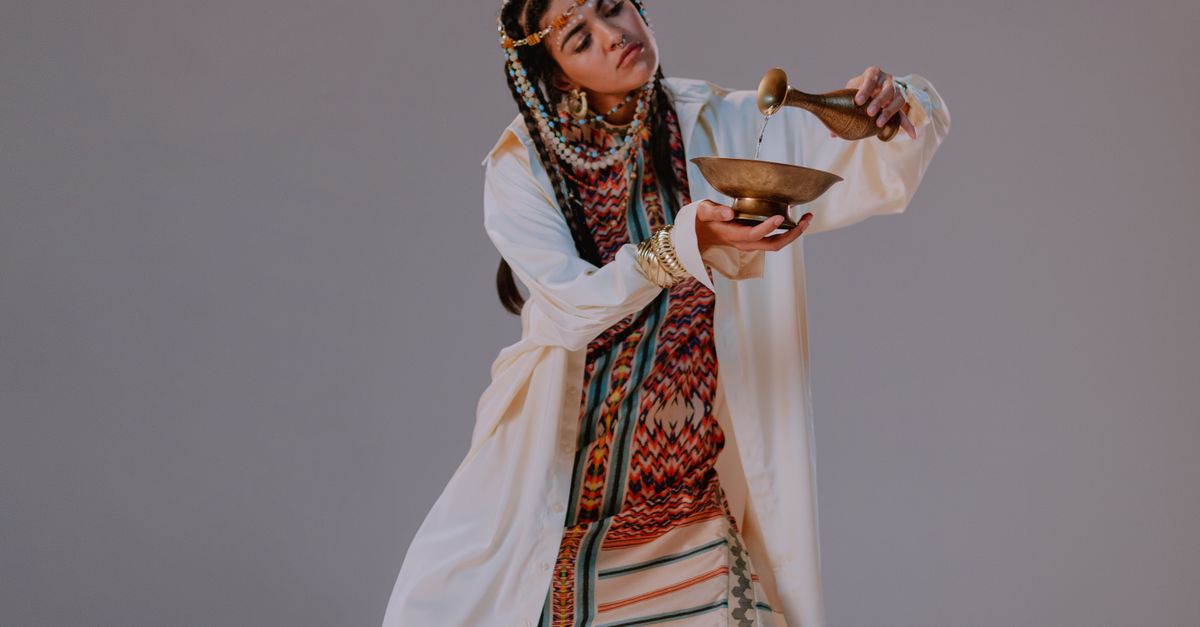 Female Ritualist Woman in Traditional Wear performing Rituals · Free Stock Photo