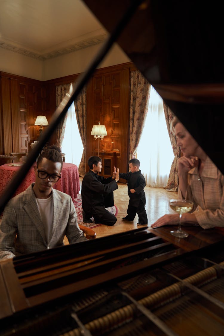 Man Playing Piano And People Practicing Martial Arts 