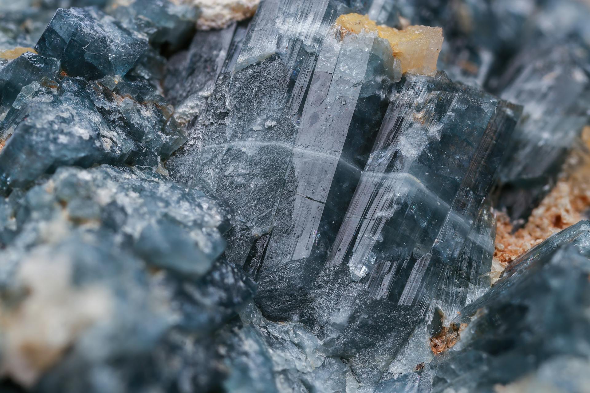 Close-up view of natural blue mineral crystal formations with textures.