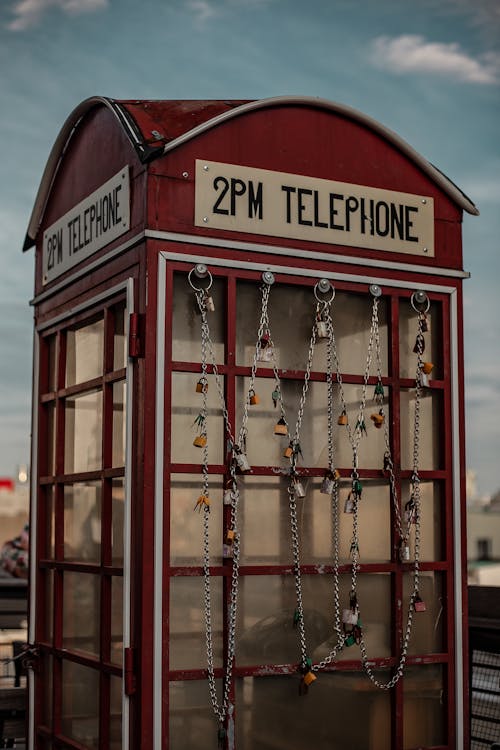 Red Telephone Booth With Wooden Frame