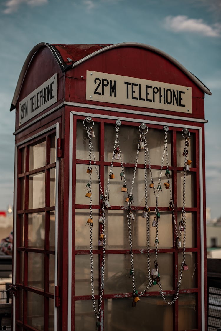 Red Telephone Booth With Wooden Frame