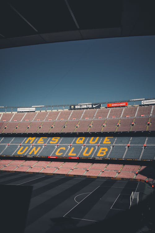 Empty Red and Blue Bleachers in a Stadium