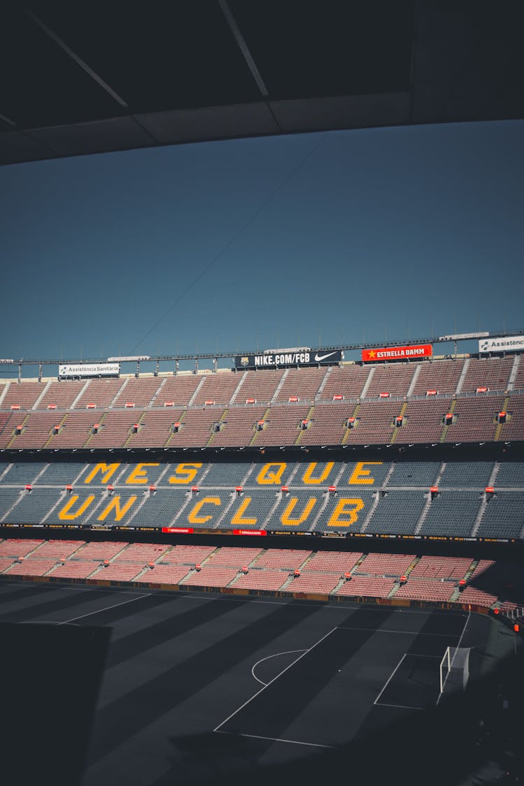 Empty Red And Blue Bleachers In A Stadium