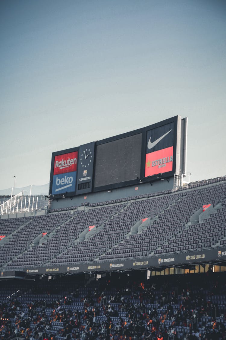 Signage In Stadium Under White Sky