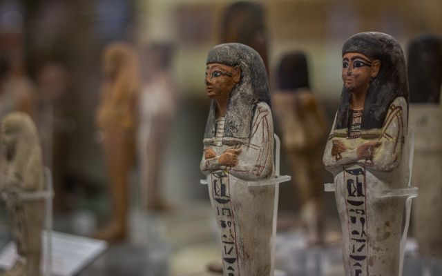 Photo: antonio filigno on Pexels Detailed view of ancient Egyptian figurines on display in a Turin museum.