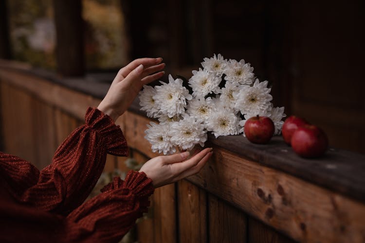 White Flowers On Brown Wooden Ledge