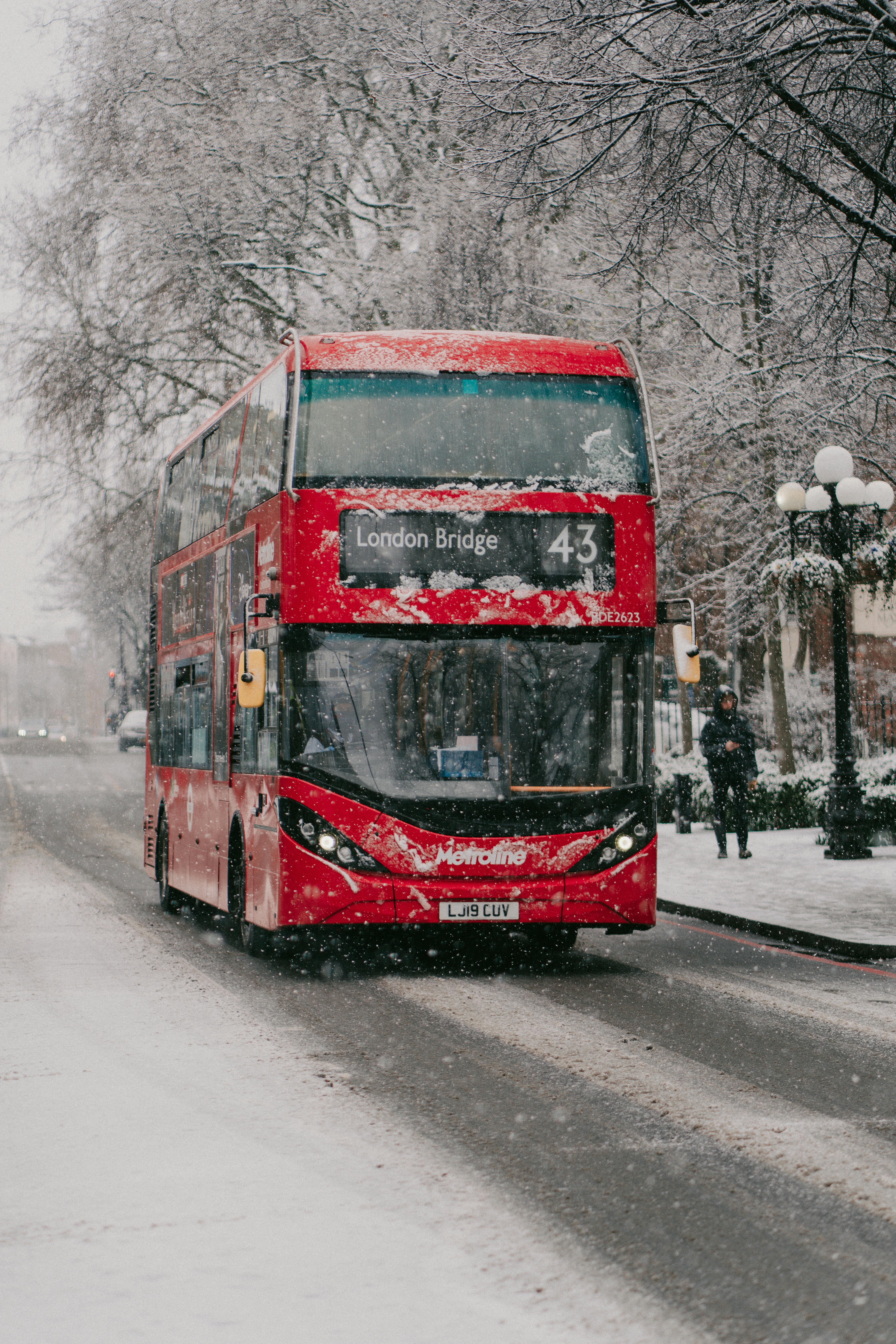 Red Double Decker Bus on Road During Winter · Free Stock Photo