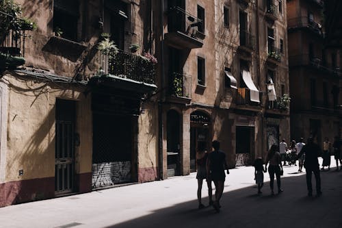 Photo of People Walking in the Street