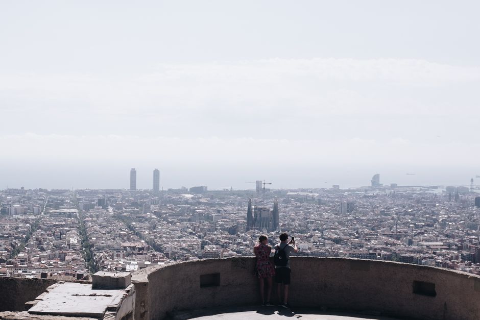 Breathtaking aerial view of Barcelona's skyline with iconic landmarks and clear sky, ideal for travel enthusiasts.