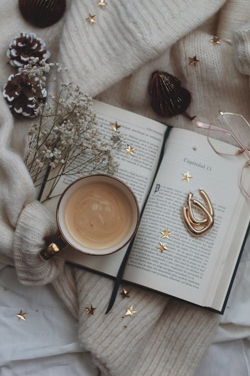 A Coffee Mug on an Open Book