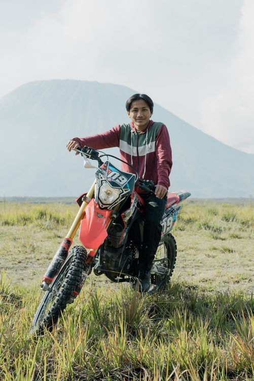 Man in Long Sleeves Riding a Red Motorcycle · Free Stock Photo