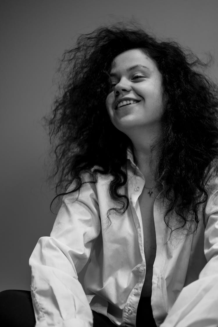 Black And White Photo Of A Woman With Unbutton Shirt