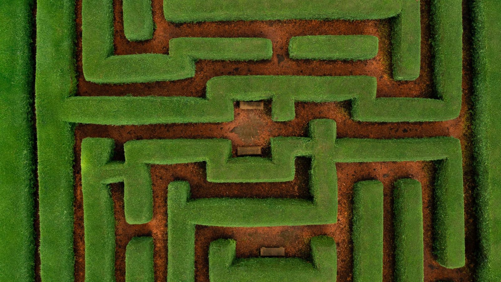 Aerial view of a green hedge maze with winding paths, a real stock photo with no people in the frame, chosen because Pan's Labyrinth is built around a labyrinth. It is not a still from the movie, and the film's own labyrinth is a crumbling stone one