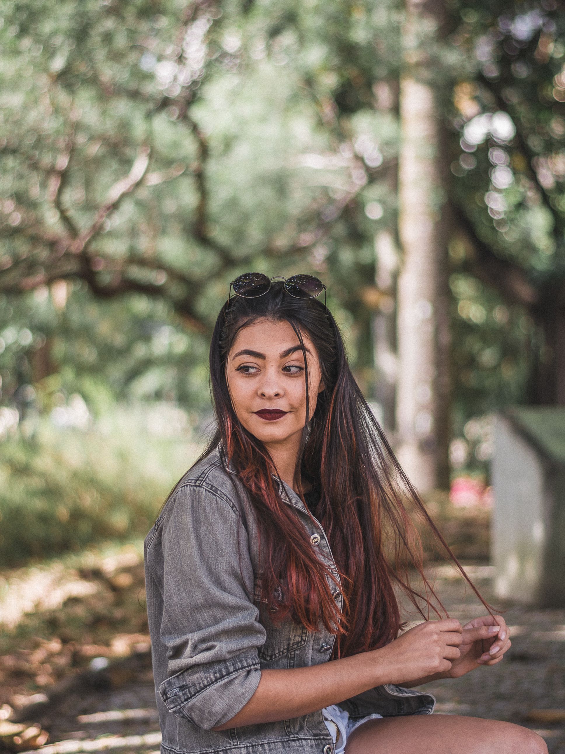 Woman Wearing Jacket Sitting on a Chair · Free Stock Photo