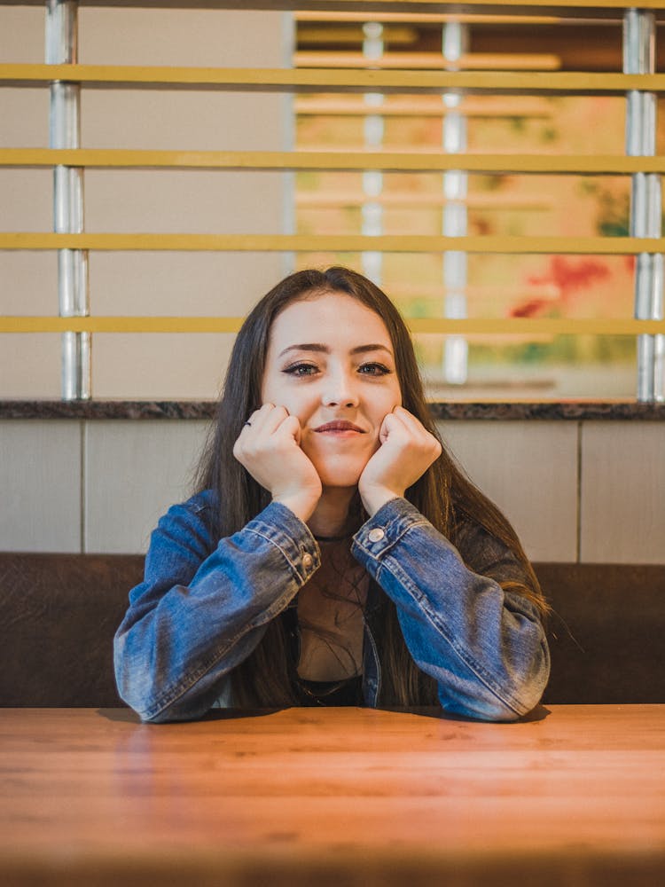 Woman Waiting At Restaurant Table