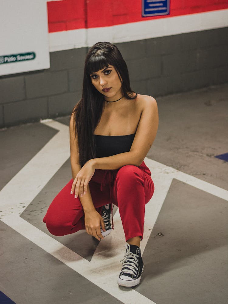 Woman Crouching And Posing