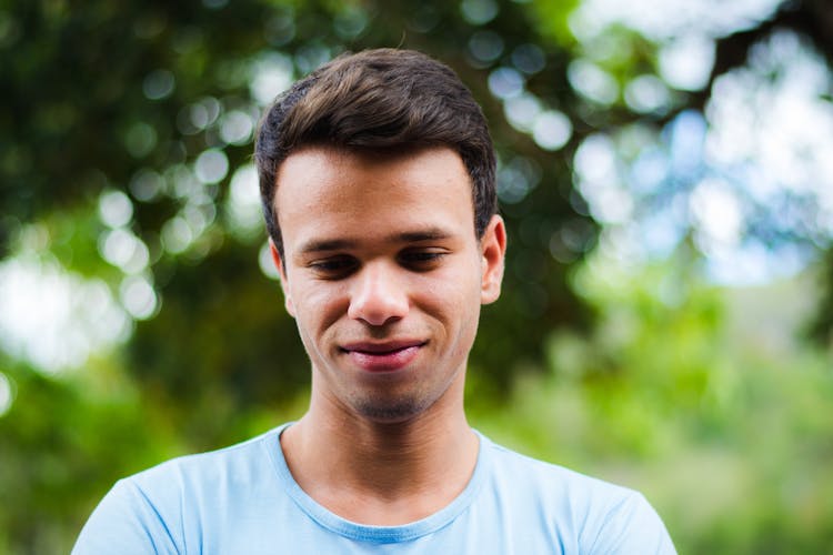 Portrait Of Shy Young Man