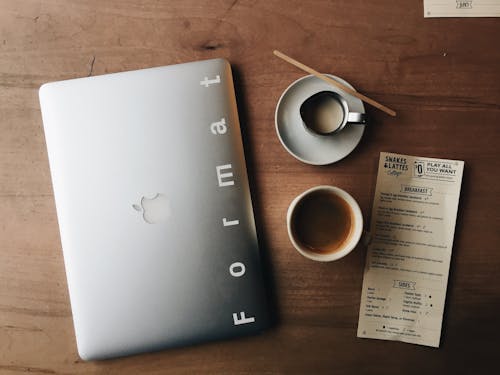 Free Photo of Macbook Near Cup and Saucer Stock Photo