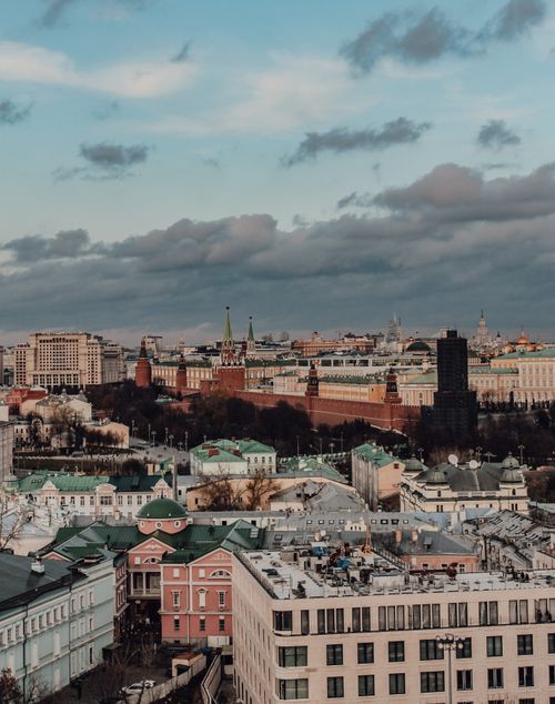 Free Aerial view of Moscow with the iconic Kremlin under a dramatic sky. Stock Photo