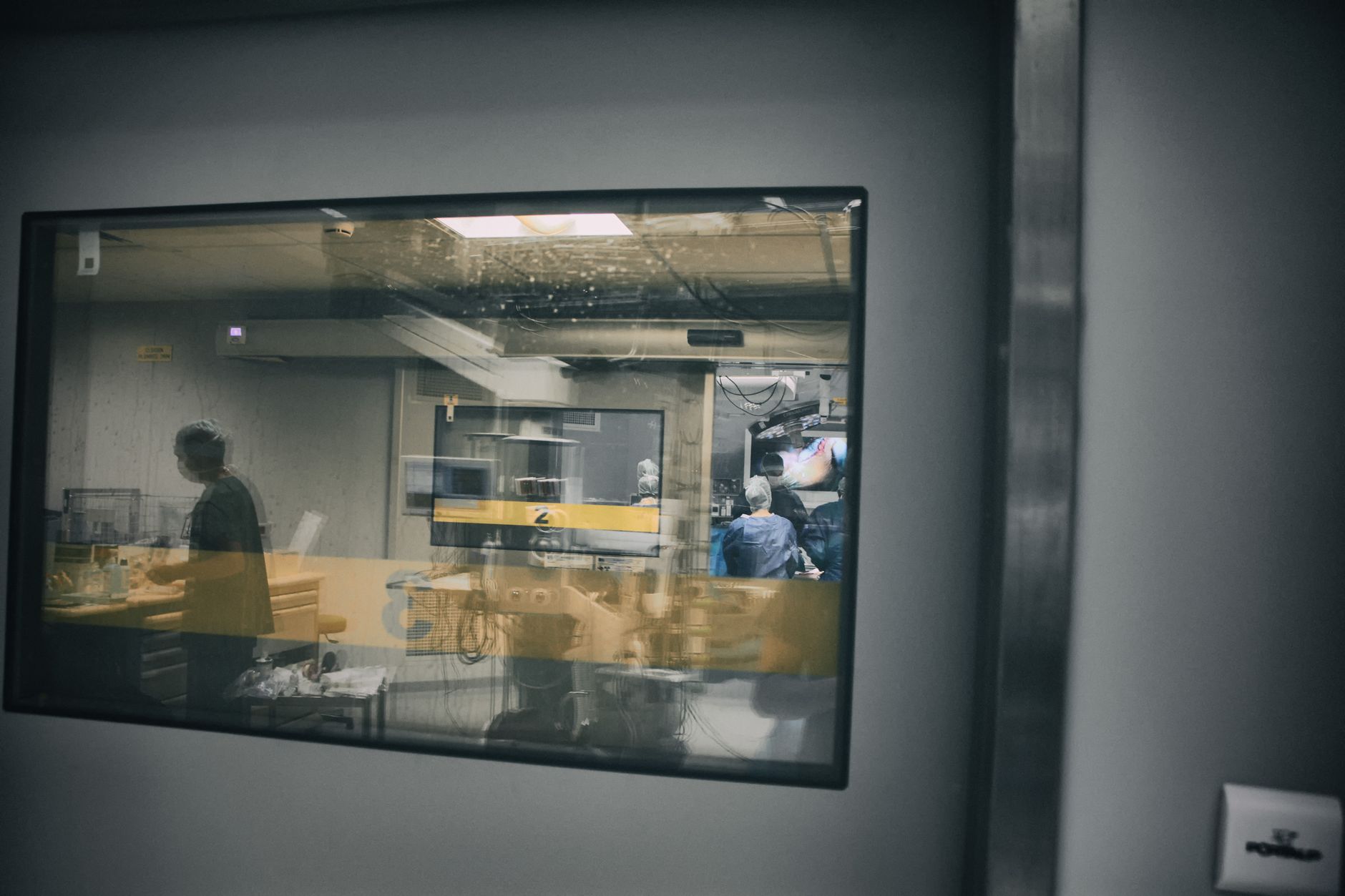 A glimpse into a surgery room, showcasing healthcare professionals at work.