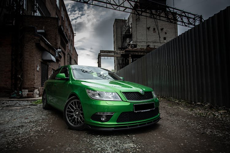 Green Car In Industrial Scenery