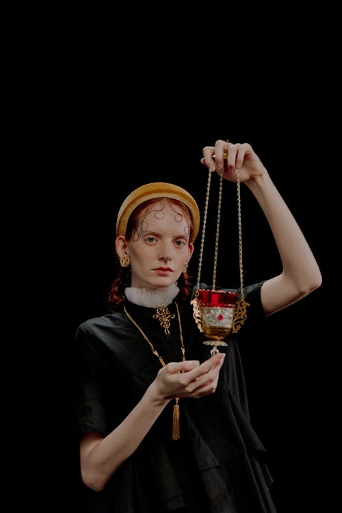 Redhead Model Posing with Thurible