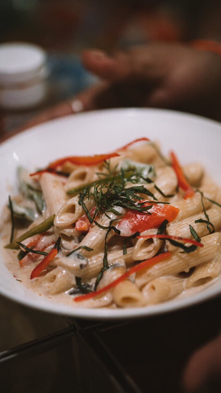 A Creamy Pasta On A Ceramic Plate