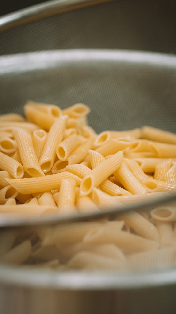 A Penne Pasta On A Strainer