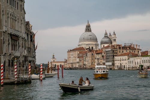 Boats Sailing in Venice Grand Canal near Santa Maria della Salute Basilica