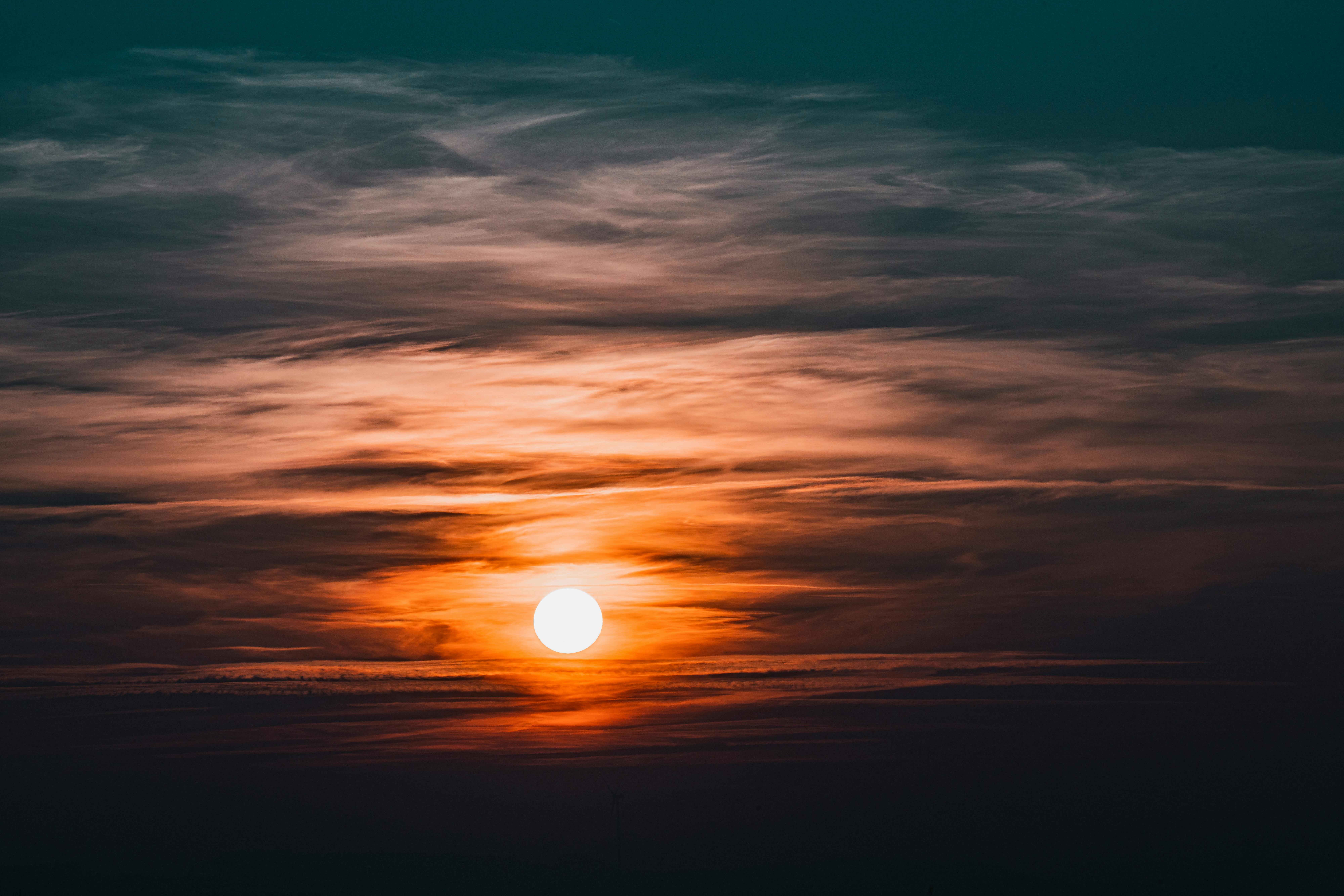 Captivating sunset view with colorful clouds enveloping the horizon, creating a warm ambiance.