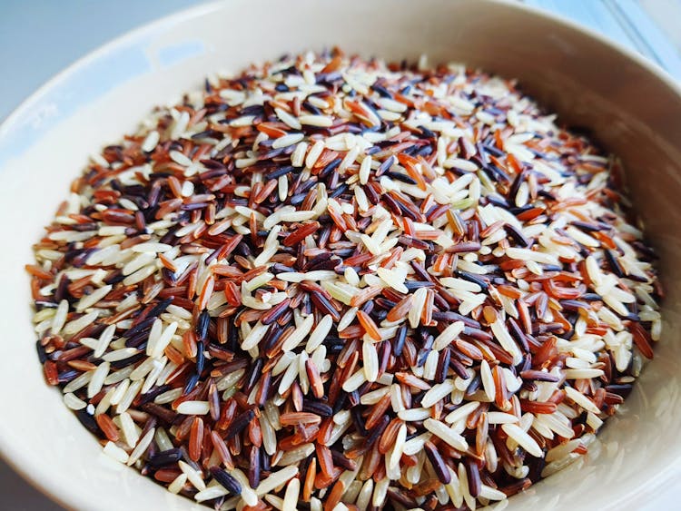 White And  Brown Rice Grains On A Bowl