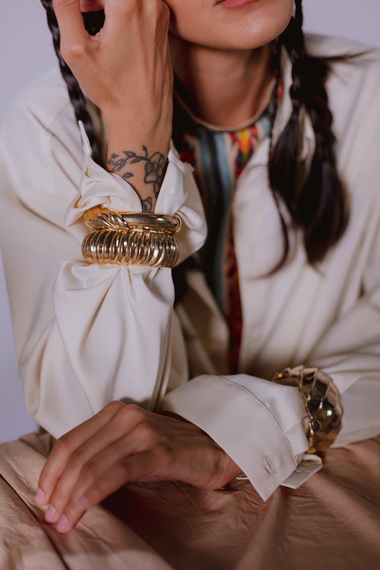 A Woman Wearing Gold Bracelet