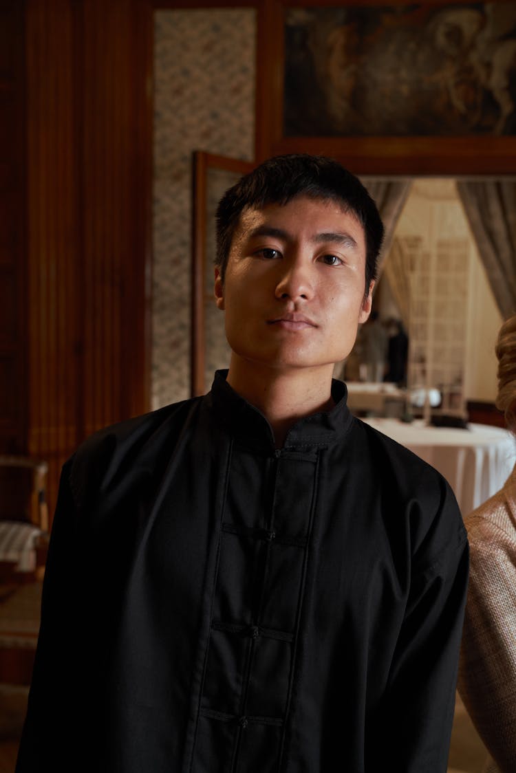 Young Asian Man In Traditional Chinese Outfit At Luxury Home 