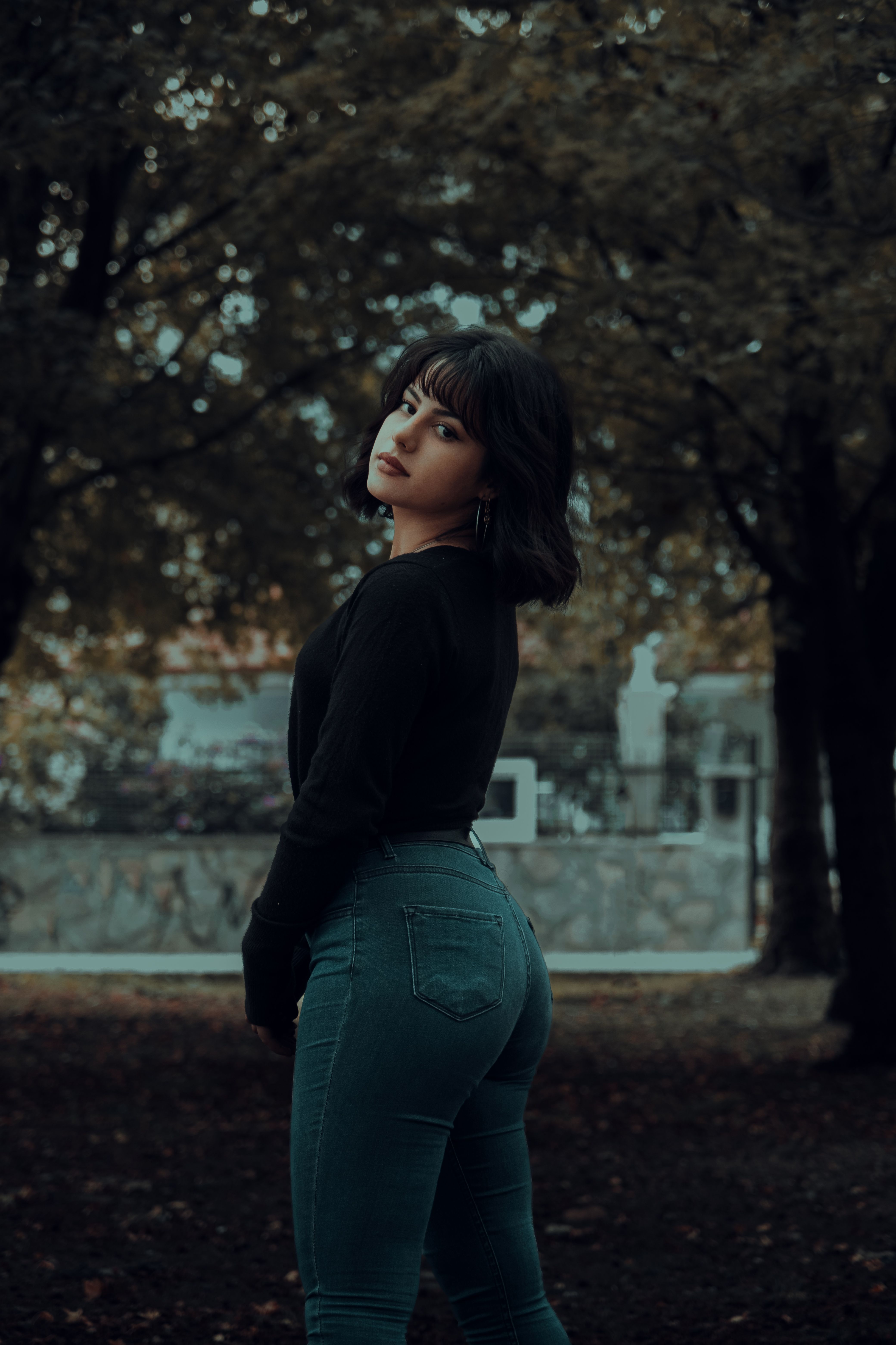 A Woman Wearing Black Sweater and Denim Jeans · Free Stock Photo