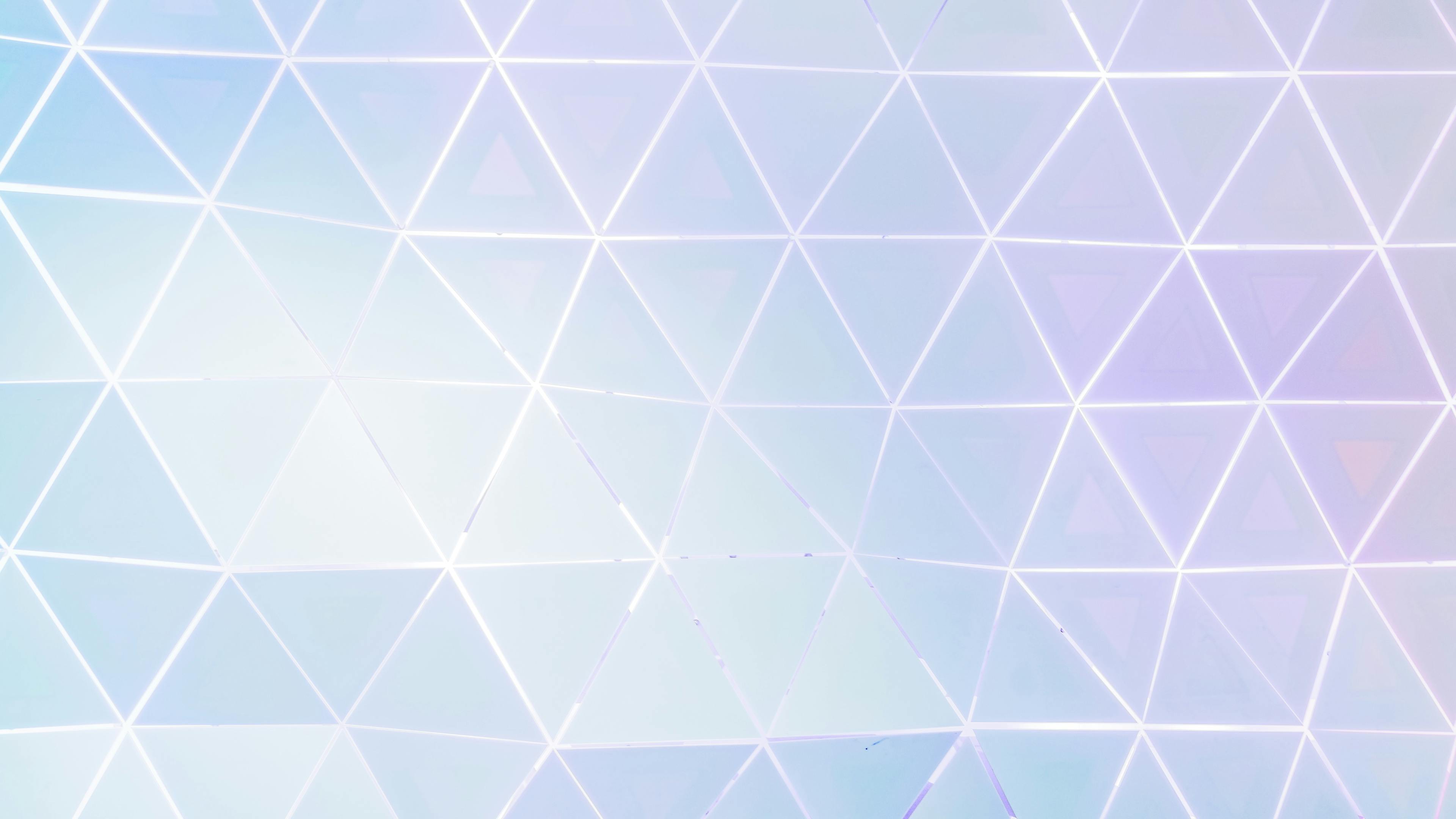 A serene abstract background with pastel geometric triangles creating a modern design.