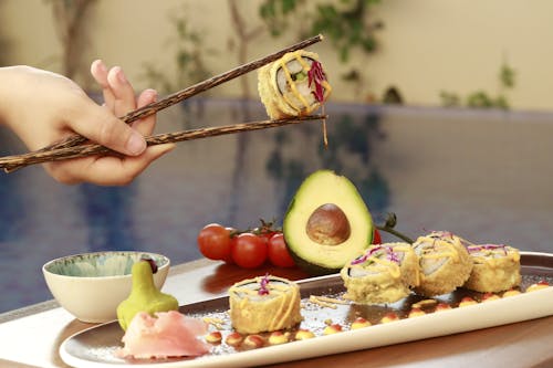 Sushi Rolls on a Ceramic Tray