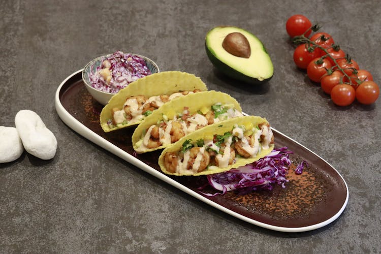Creamy Prawns And Salad On Taco Shells On A Ceramic Tray