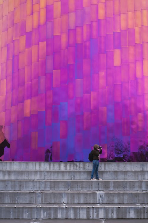 Woman Standing on Stair Taking Picture