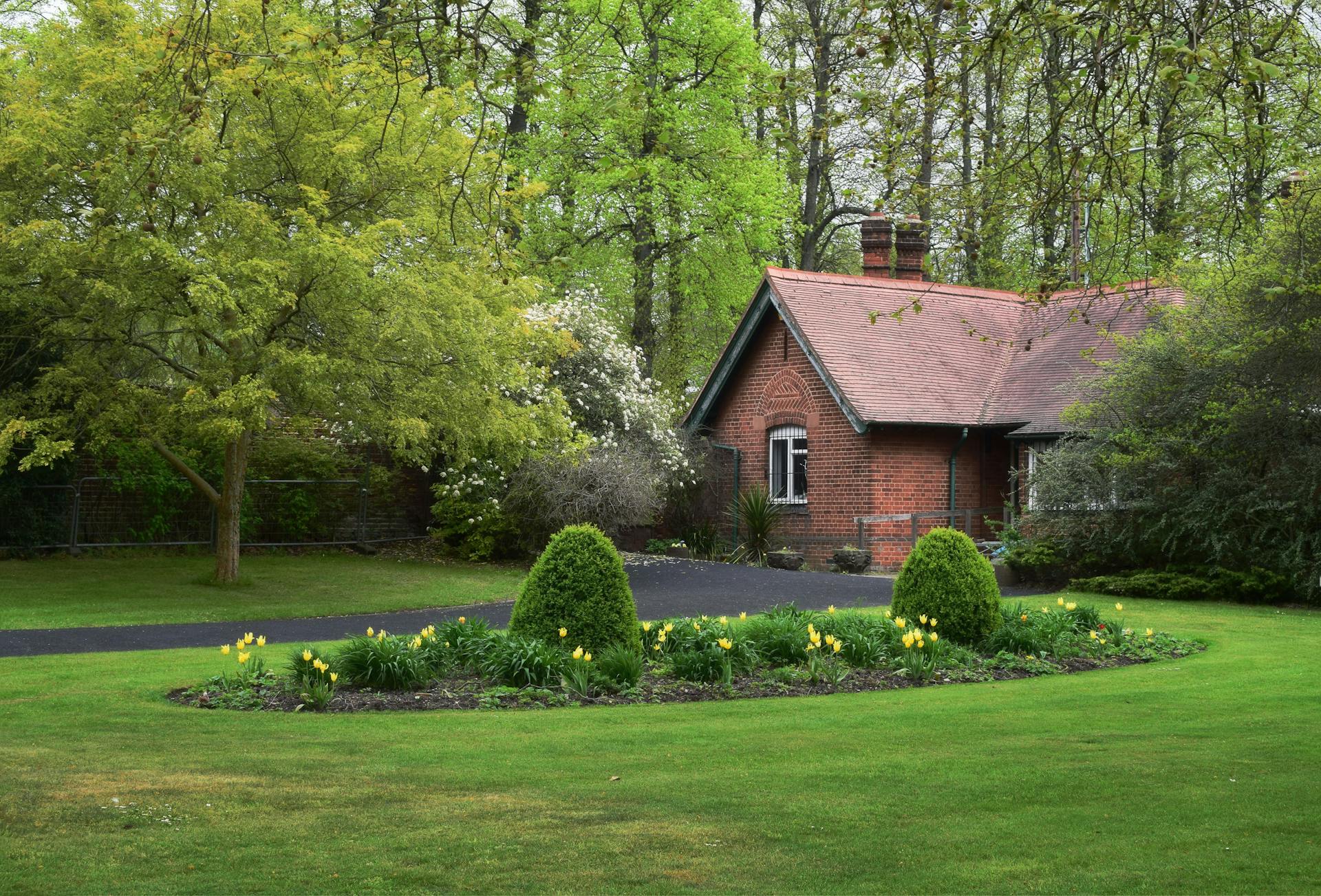 Picturesque brick cottage surrounded by a green garden in Dartford, UK.