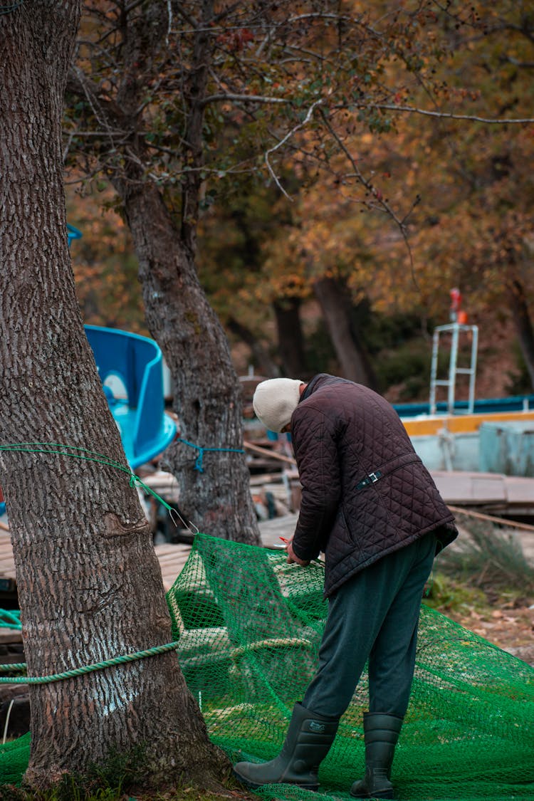 Man Installing Net In Park