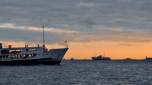 Ferries on the Ocean during Sunset