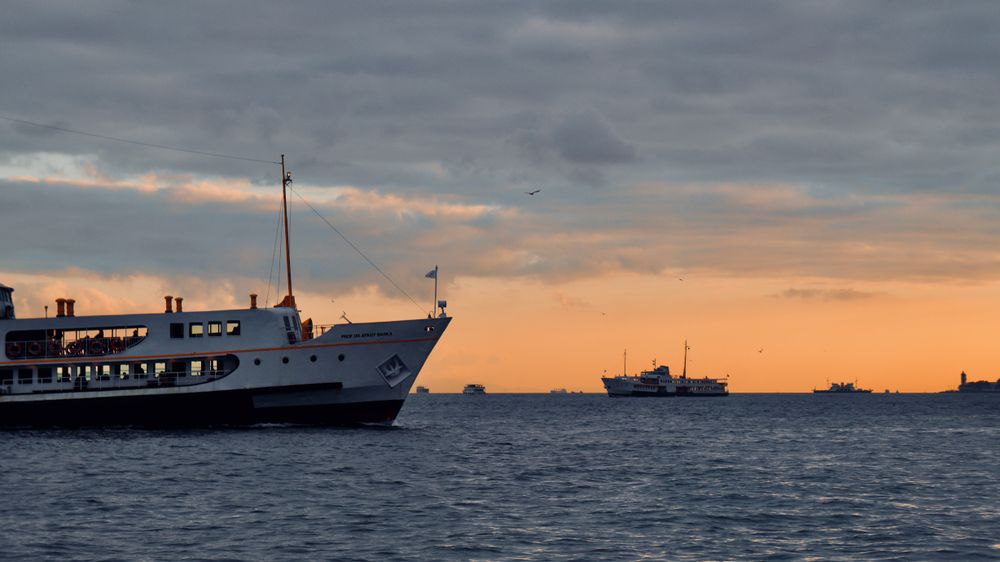 Ferries crossing the water at sunset — Ikbal Alahmad on Pexels