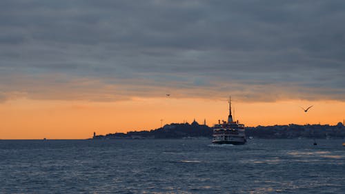View of a Ferry on the Bosphorus Strait at Sunset in Istanbul, Turkey