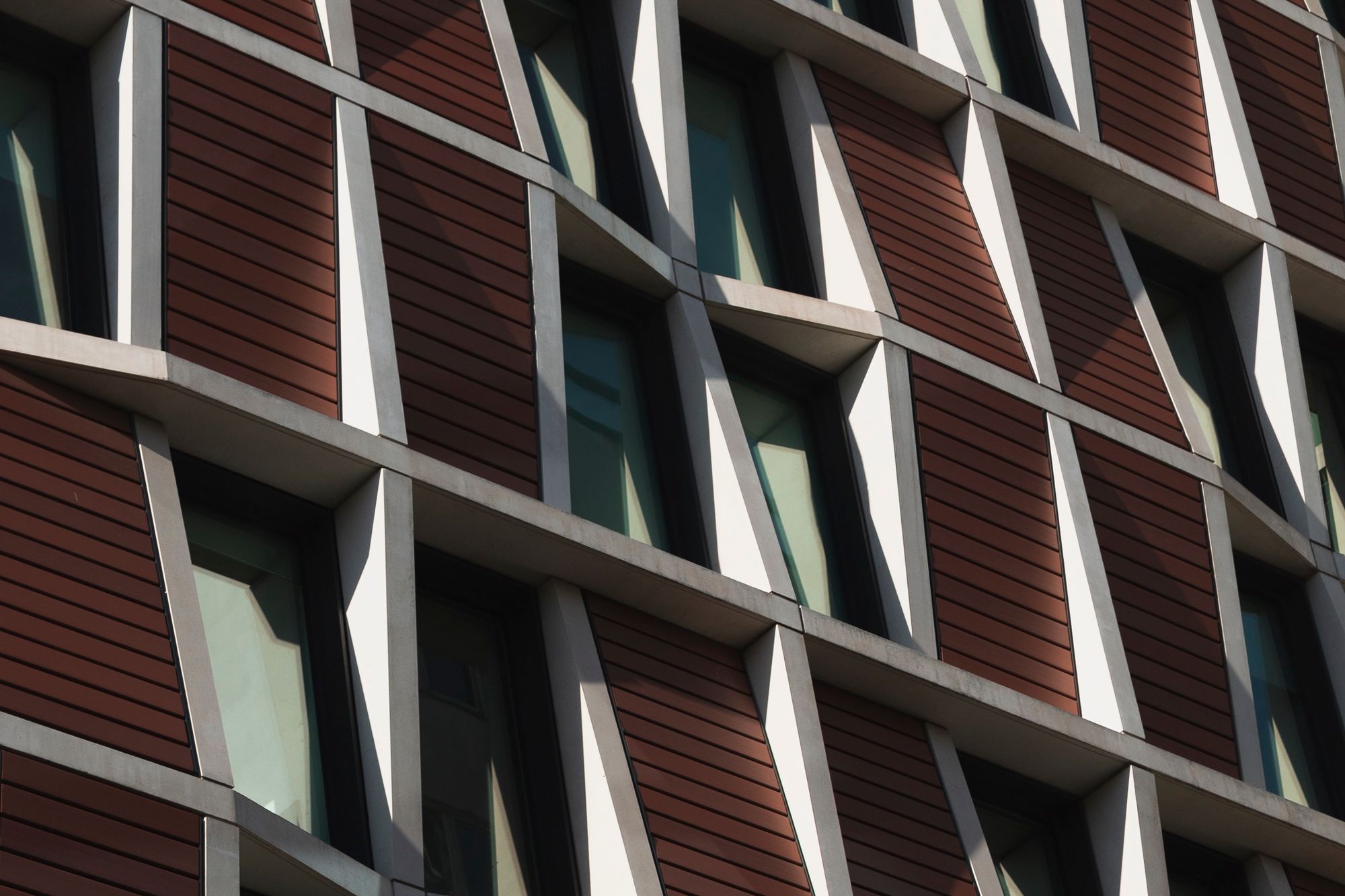 Artist's impression: close detail of a modern stone and metal building facade.