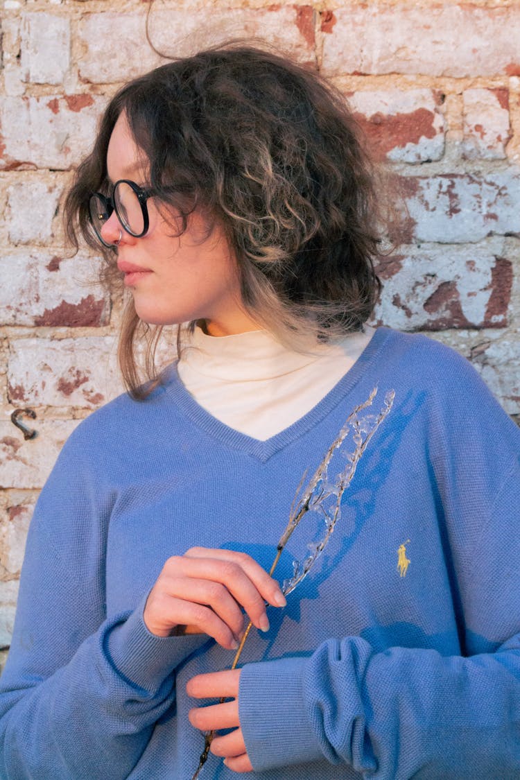 Portrait Of Woman In Blue Blouse And Eyeglasses