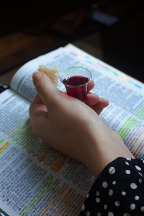 A Person Holding a Shot Glass