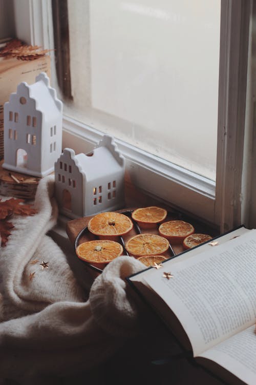 Slices of Dried Oranges Near Glass Window