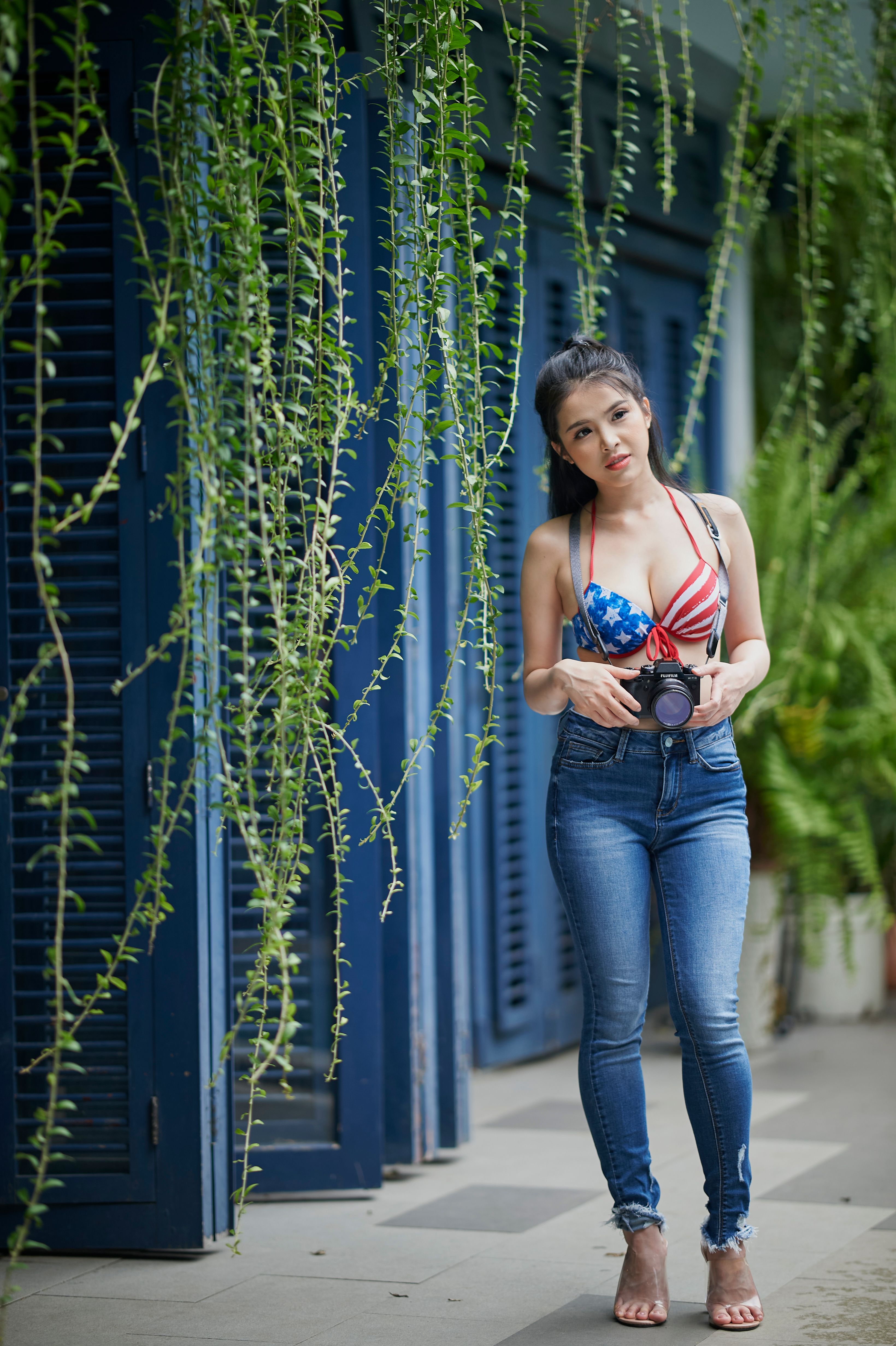 Brunette Woman with Camera in Hands